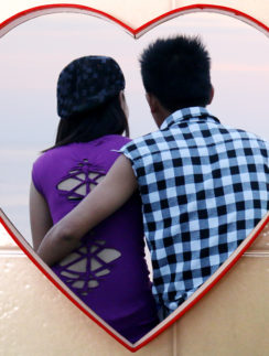 Couple at Manila Bay in a heart.