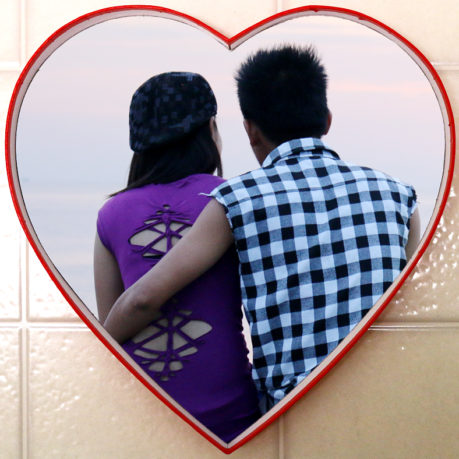 Couple at Manila Bay in a heart.