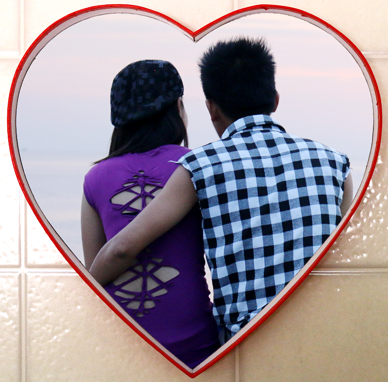 Couple at Manila Bay in a heart.