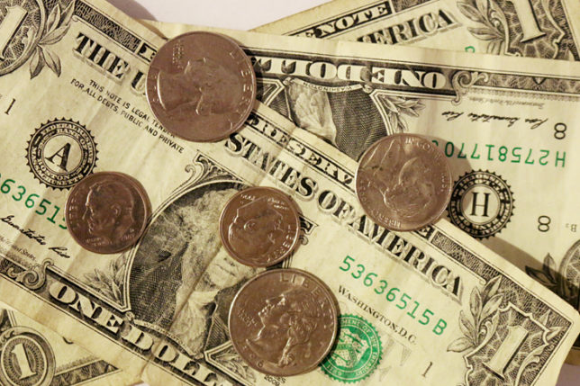 Dollar bills and coins for tip or gratuity