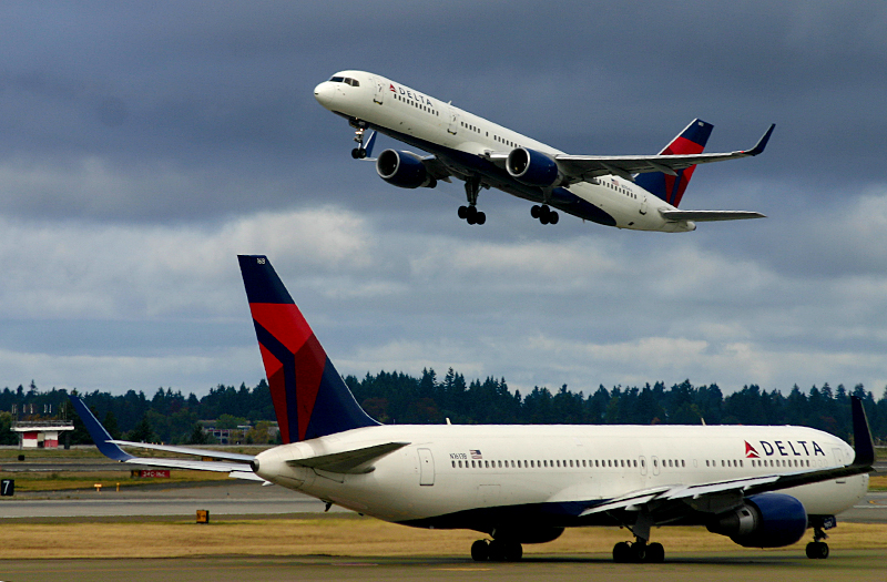 Delta Air Lines airplanes on runway and tarmac in Seattle