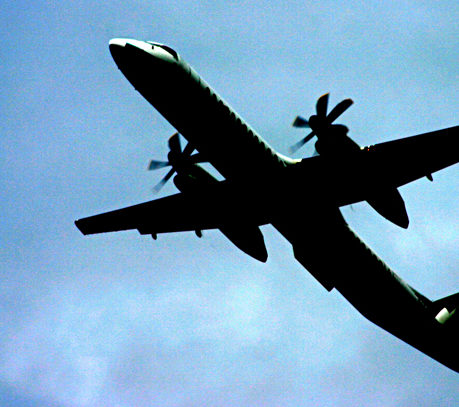 Propeller airplane ascending