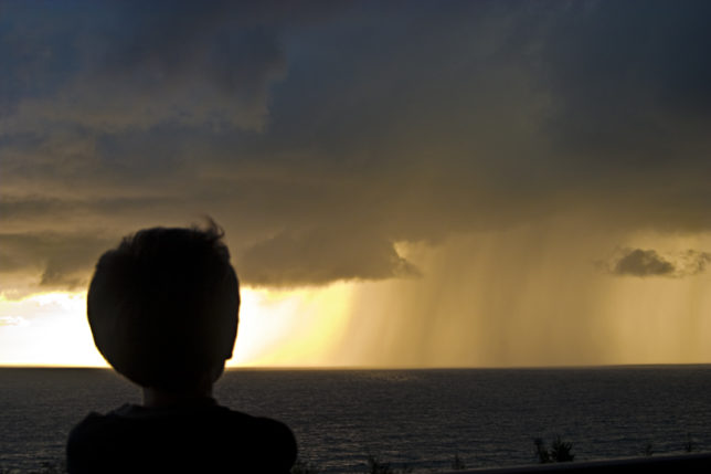 Boy sunset thunderstorm