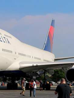 Boeing 747-451 Next to a McDonnell Douglas DC-9-51 Delta Air Lines