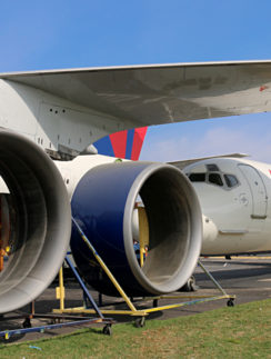 Boeing 747-451 Next to a McDonnell Douglas DC-9-51 Delta Air Lines