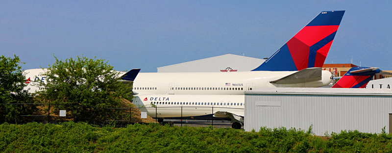 Boeing 747-451 Next to a McDonnell Douglas DC-9-51 Delta Air Lines