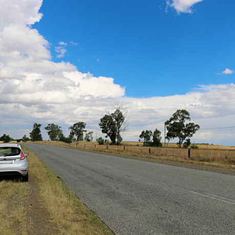 Car with flat tire road