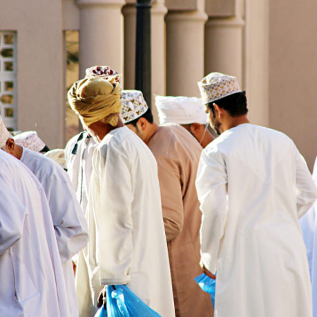 Men dressed in traditional Muslim thobes.