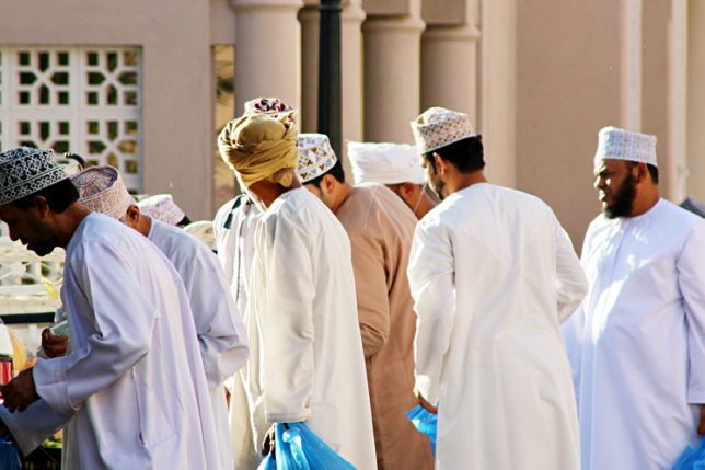 Men dressed in traditional Muslim thobes.