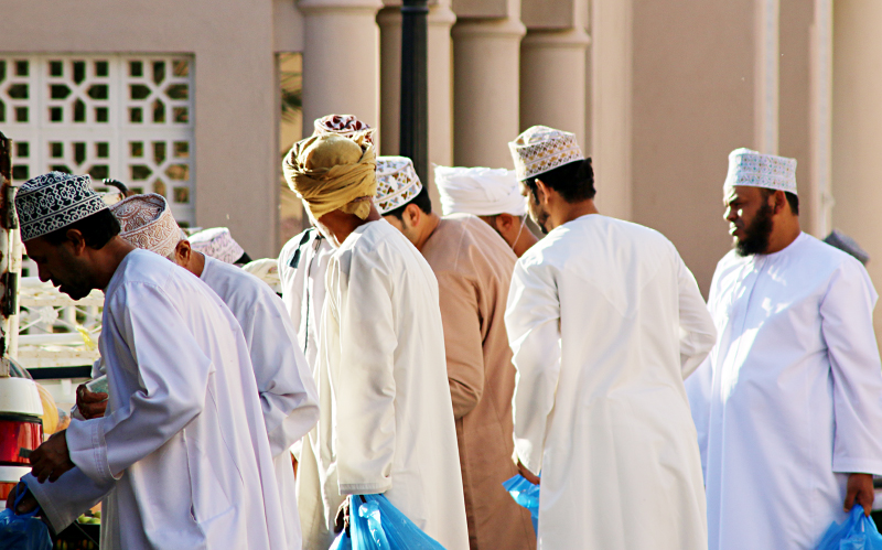Men dressed in traditional Muslim thobes.