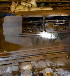 Surveying track damage in Canarsie Tunnel