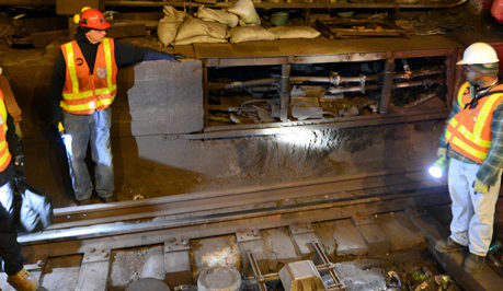Surveying track damage in Canarsie Tunnel
