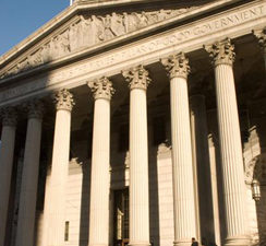 a group of people standing outside of a building