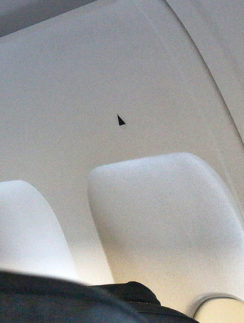 black triangles airplane window