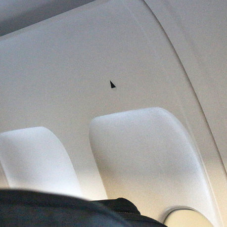 black triangles airplane window