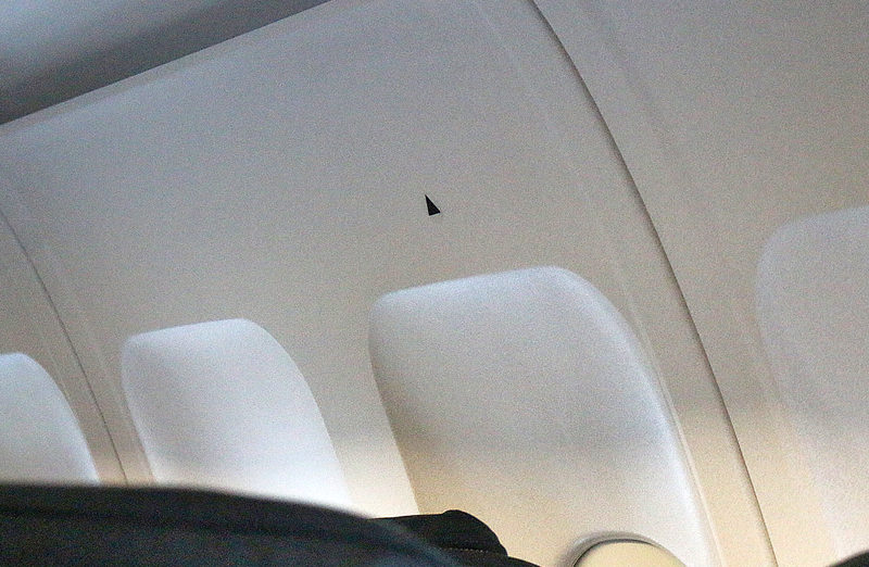 black triangles airplane window
