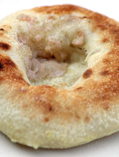 a round brown bread with a hole in it