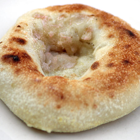 a round brown bread with a hole in it