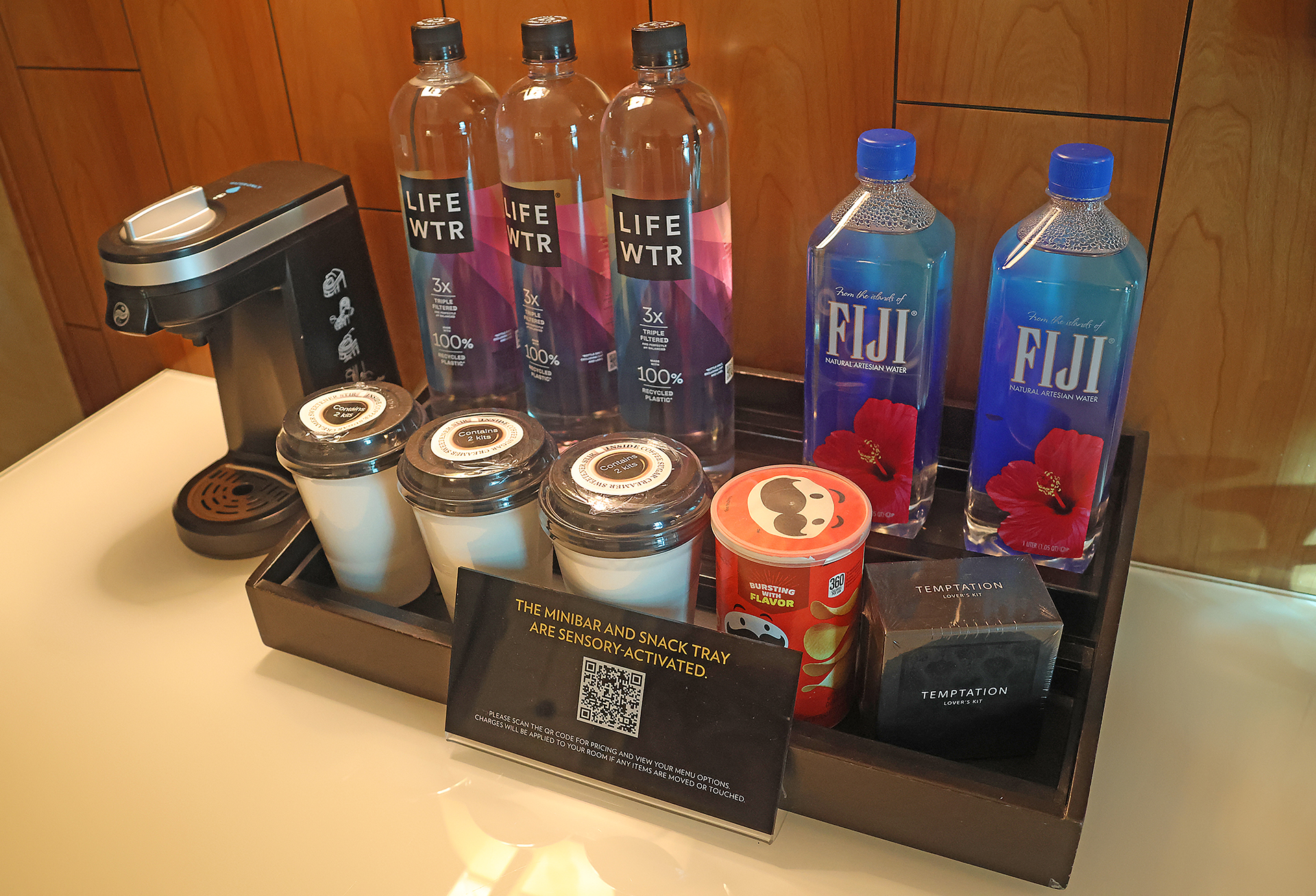 a group of bottles and cups on a table