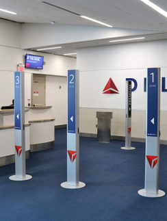 branded pillars boarding gate Delta Air Lines