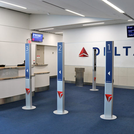 branded pillars boarding gate Delta Air Lines