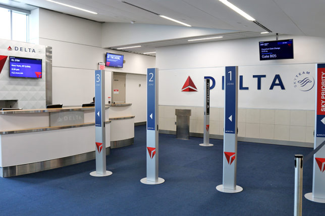 branded pillars boarding gate Delta Air Lines