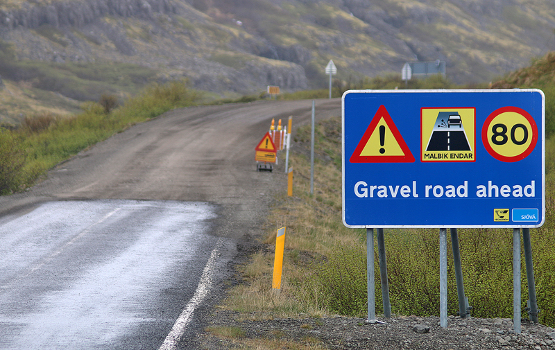 Gravel road warning sign Iceland