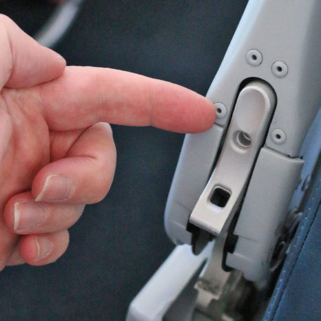 secret armrest button aisle