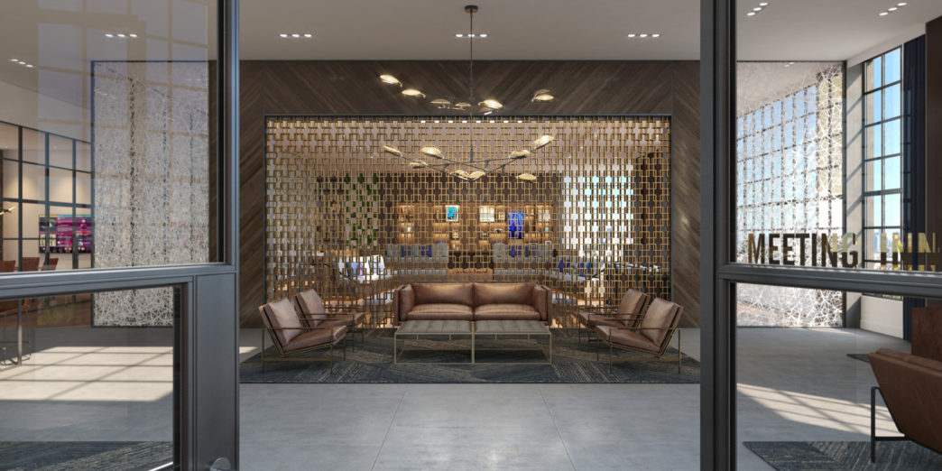 a room with a couch and chairs