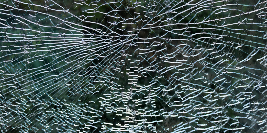 a close up of a broken window