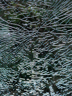 a close up of a broken window