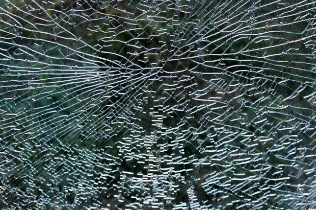 a close up of a broken window