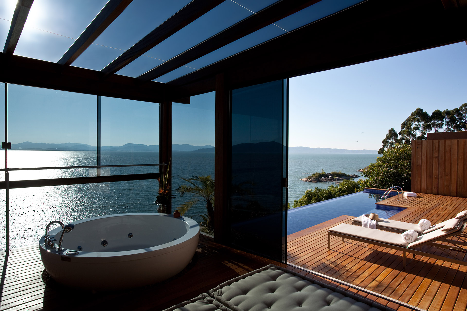 a large tub overlooking a body of water