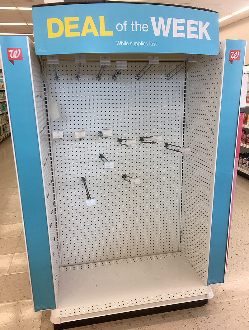 a large display case with pegs and hooks