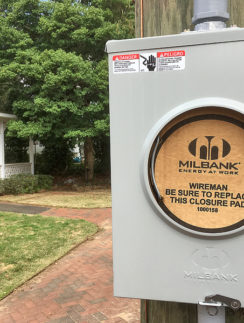 a electrical box on a wooden pole