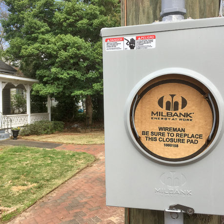a electrical box on a wooden pole