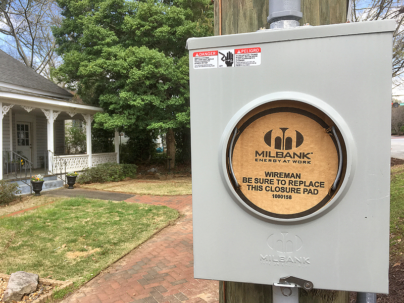 a electrical box on a wooden pole