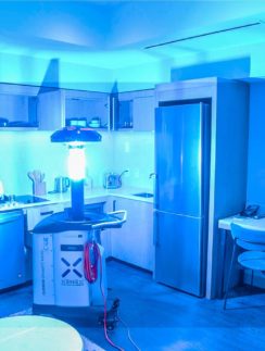 a kitchen with a light on the floor