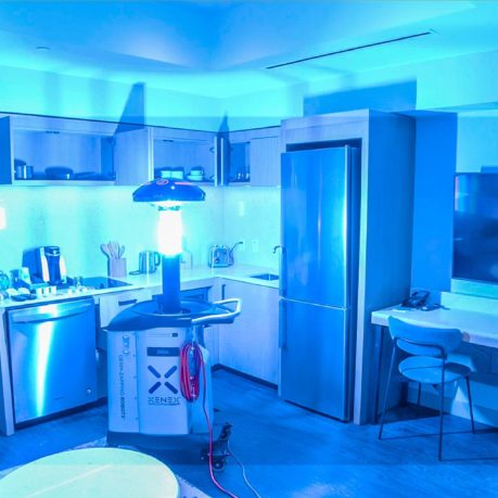 a kitchen with a light on the floor