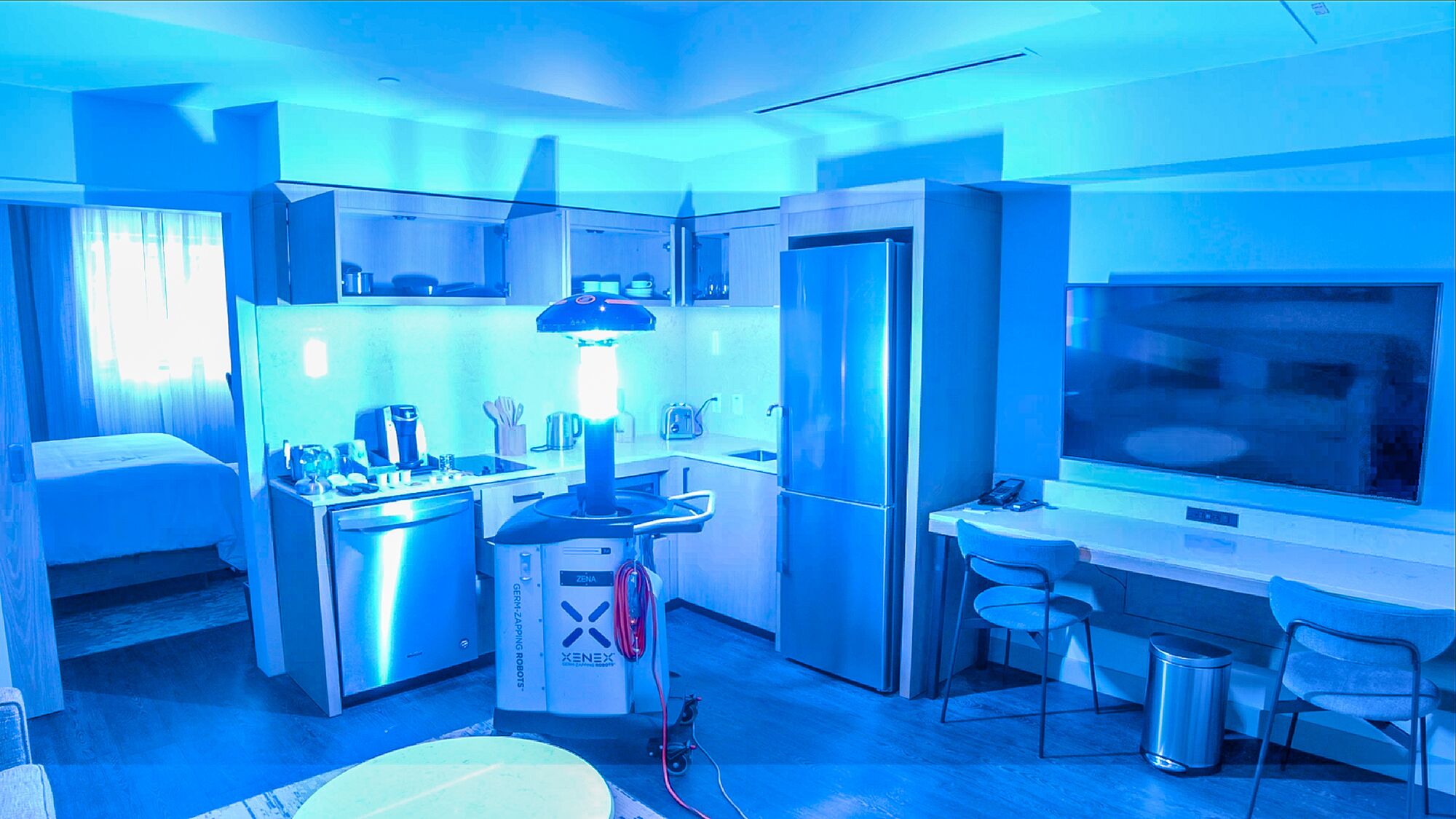 a kitchen with a light on the floor