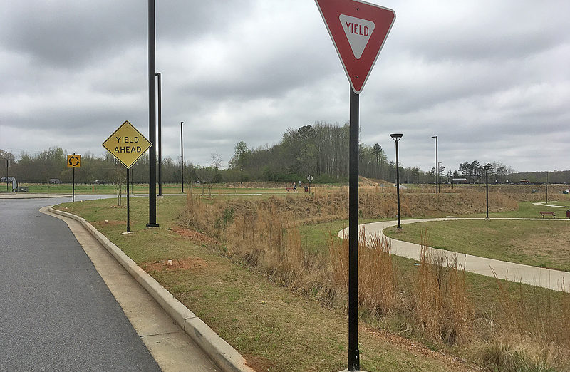 a yield sign on a pole