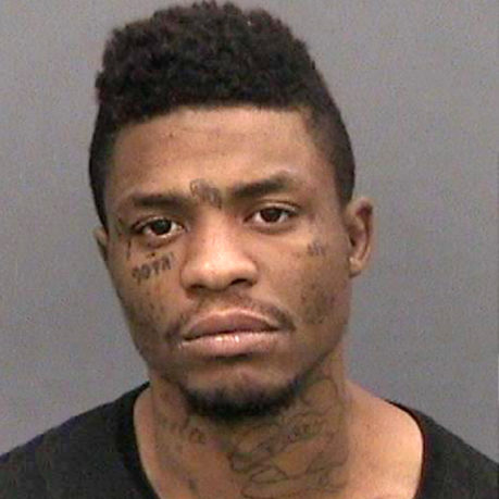 a man with tattoos on his neck