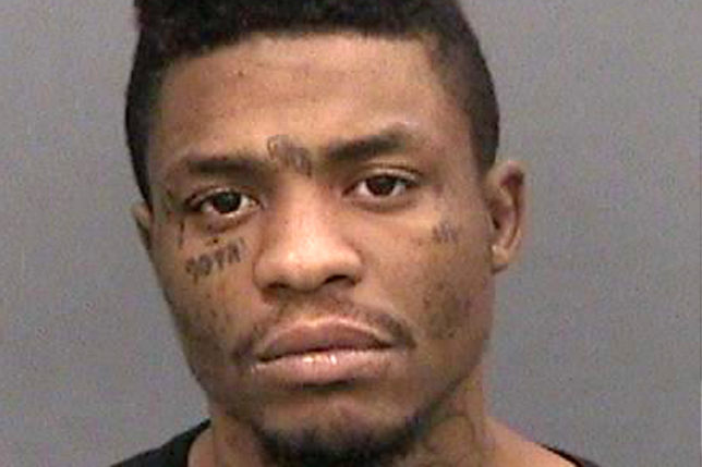 a man with tattoos on his neck