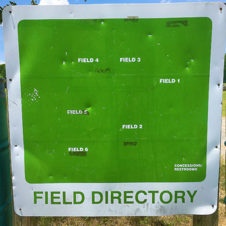 a sign with holes in it