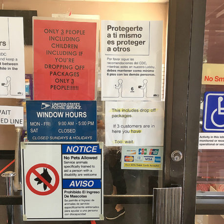 a sign on a glass door