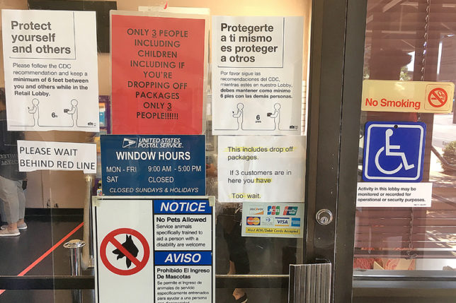 a sign on a glass door