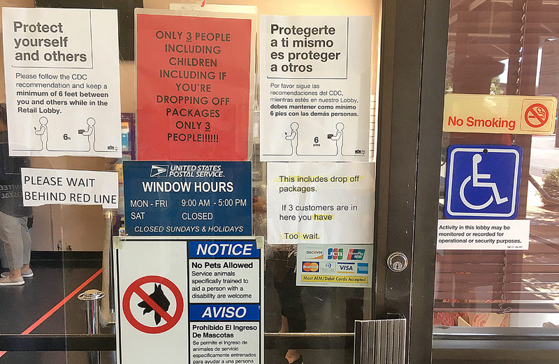 a sign on a glass door