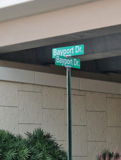 a street sign under a bridge