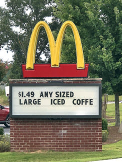 a sign on a brick wall