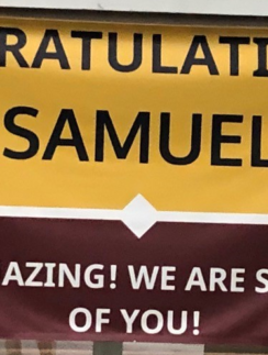 a yellow and red sign with black text